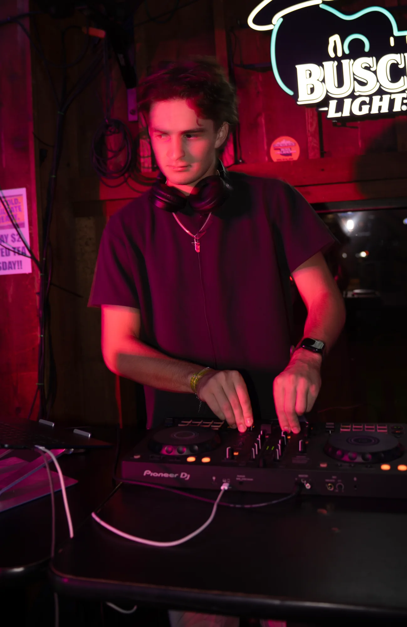 Lane Watt mixing at the decks under red venue light
